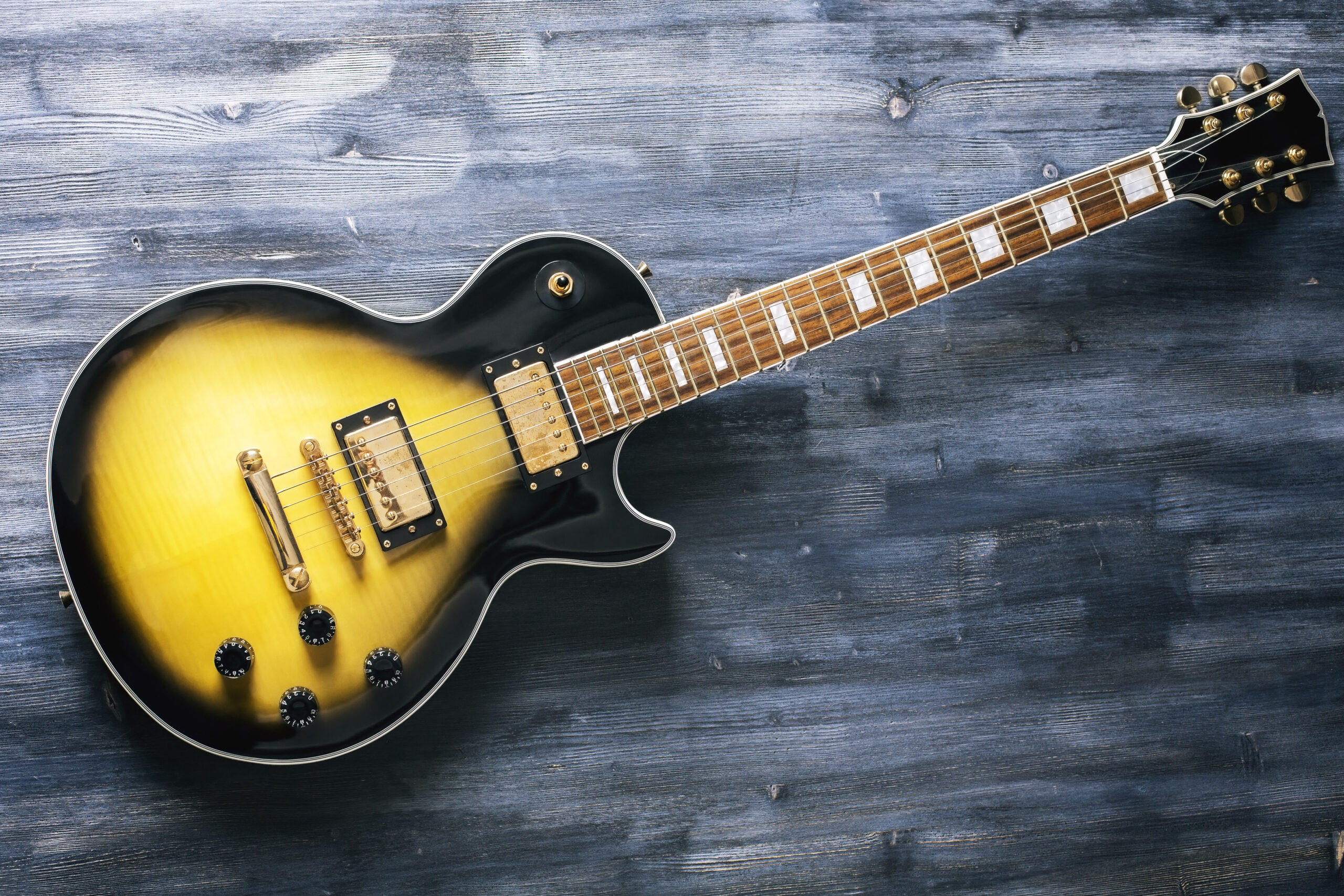 Top View Of Black And Yellow Electric Guitar